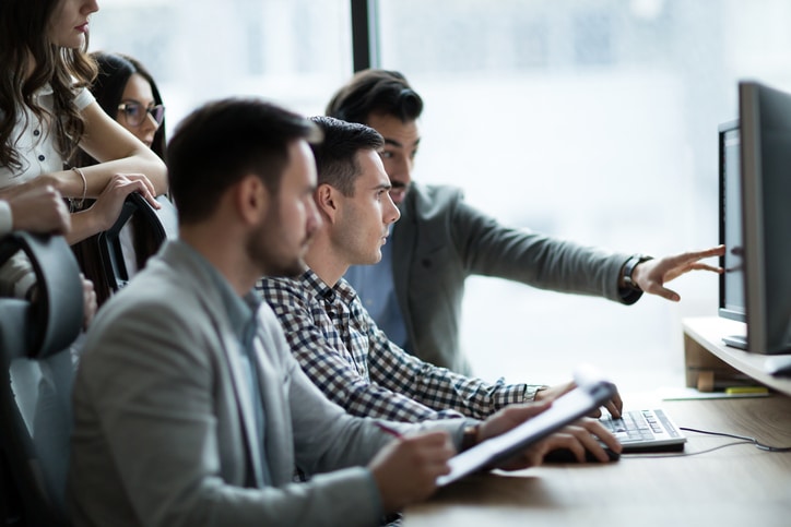 How to Choose the Best Oil and Gas Accounting Software - team with software - Council of Petroleum Accountants Societies